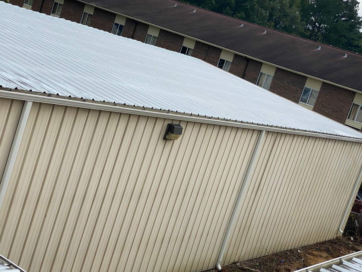 Commercial building roofline and siding after washing