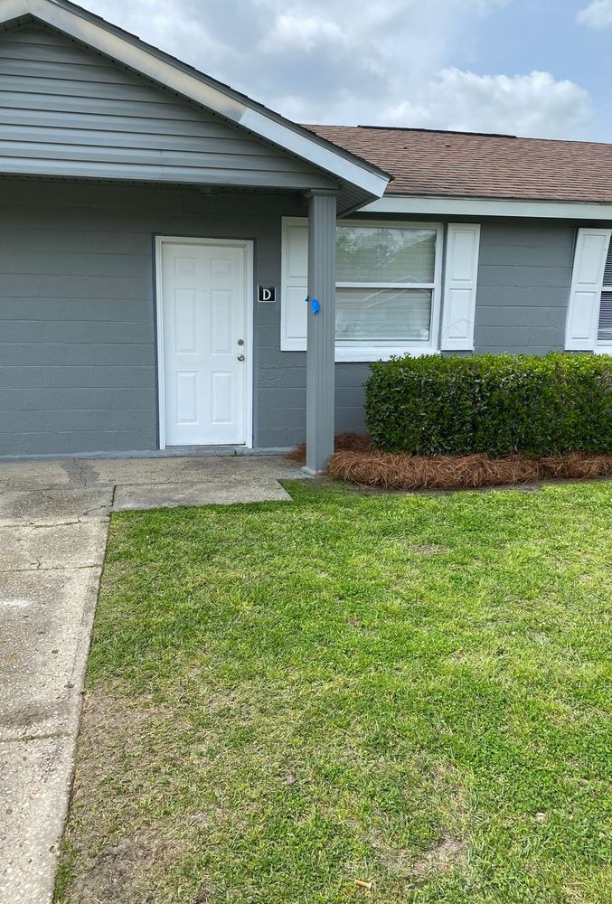 Gray painted duplex entry with fresh white door and trim
