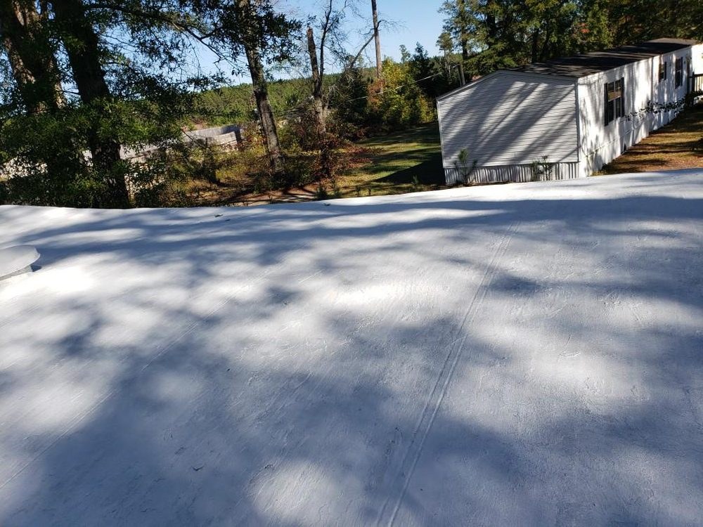 Mobile home roof after a fresh white roof coating